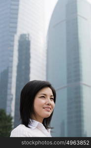 Chinese businesswoman near skyscrapers