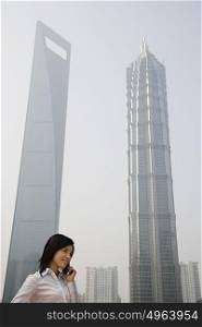 Chinese businesswoman near skyscrapers