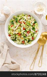 Chinese cabbage salad with chicken meat, top view 