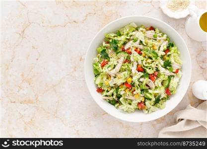 Chinese cabbage salad with chicken meat, top view
