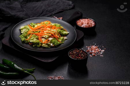 Chinese cabbage with carrots and apples, delicious salad. Vegitarian cuisine. Chinese cabbage with carrots and apples, delicious salad