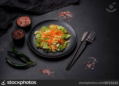 Chinese cabbage with carrots and apples, delicious salad. Vegitarian cuisine. Chinese cabbage with carrots and apples, delicious salad