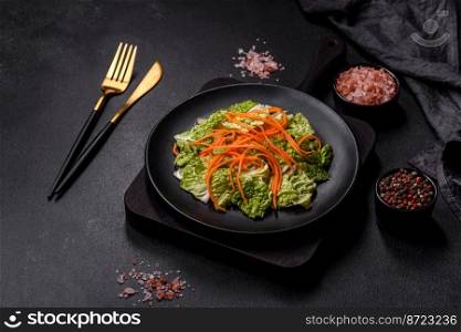 Chinese cabbage with carrots and apples, delicious salad. Vegitarian cuisine. Chinese cabbage with carrots and apples, delicious salad