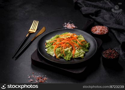 Chinese cabbage with carrots and apples, delicious salad. Vegitarian cuisine. Chinese cabbage with carrots and apples, delicious salad