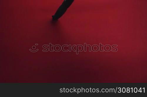 Chinese calligraphy. Writing on red paper