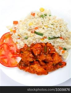 Chinese chicken sweet and sour with vegetable fried rice on a plate