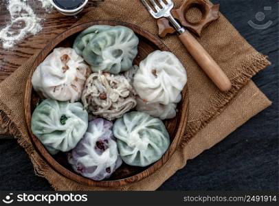 Chinese chives Dumplings Mixed Color or Garlic Chives Dim Sum Rice Cake inside with Taro Slice ,Bamboo shoot and Many kind of vegetable inside the flour, Steamed Served Sweet Black Soy Sauce Chinese Food Style side view, Chinese Food Appetizer dish Style, Top view.