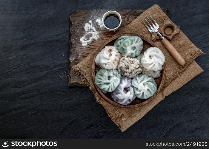 Chinese chives Dumplings Mixed Color or Garlic Chives Dim Sum Rice Cake inside with Taro Slice ,Bamboo shoot and Many kind of vegetable inside the flour, Steamed Served Sweet Black Soy Sauce Chinese Food Style side view, Chinese Food Appetizer dish Style, Top view.