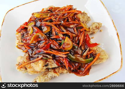 chinese cuisine. deep fried chicken with red sauce.