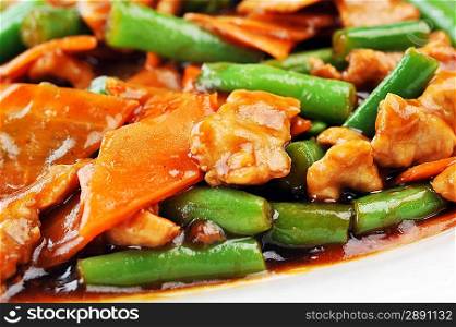chinese cuisine. deep fried chicken with red sauce and beans