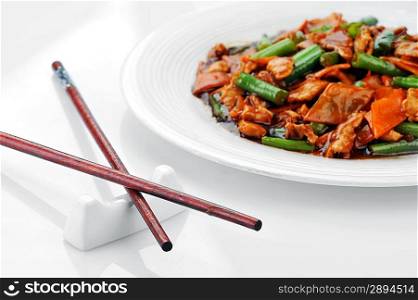 chinese cuisine. deep fried chicken with red sauce and beans