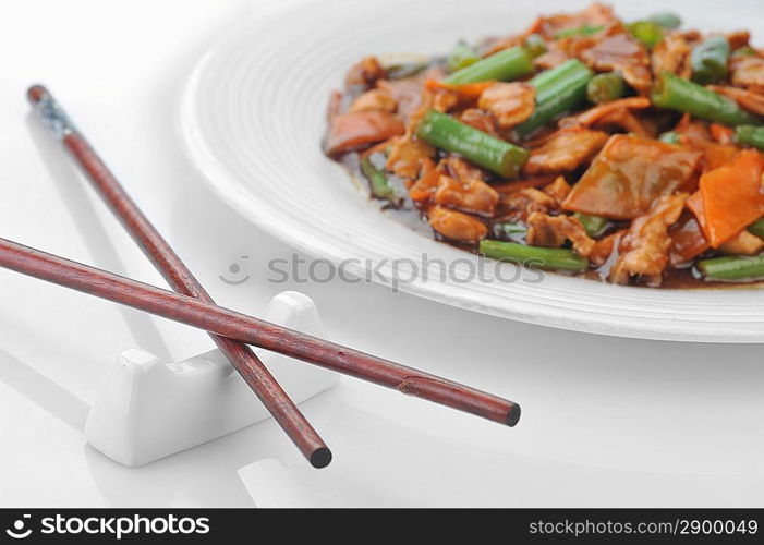 chinese cuisine. deep fried chicken with red sauce and beans