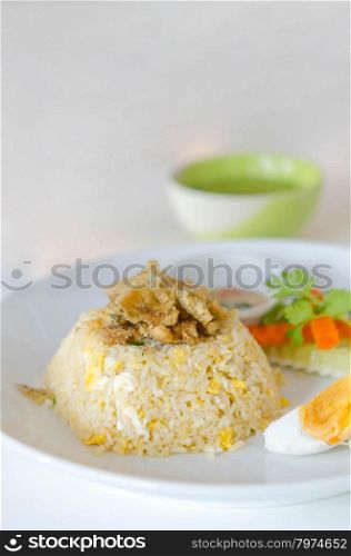 Chinese cuisine, fried rice with fish , salted egg and fresh vegetable