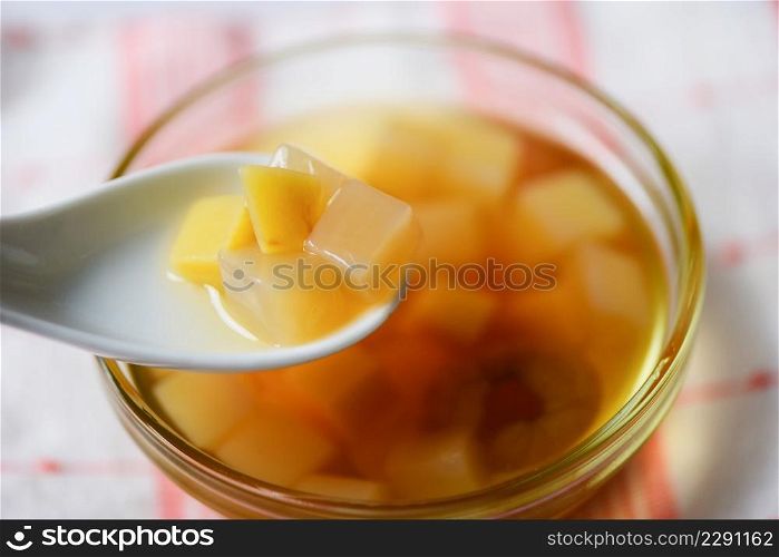 Chinese desserts, Mix ginkgo nuts cassava syrup coconut jelly in longan juice on glass bowl, Thai and Chinese longan date soup Asian dessert sweets