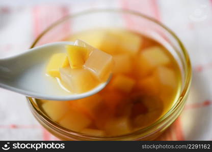 Chinese desserts, Mix ginkgo nuts cassava syrup coconut jelly in longan juice on glass bowl, Thai and Chinese longan date soup Asian dessert sweets