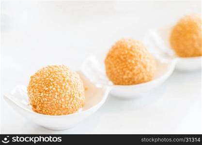 Chinese dim sum Fried sesame balls stuff with custard lava - Chinese groumet cuisine