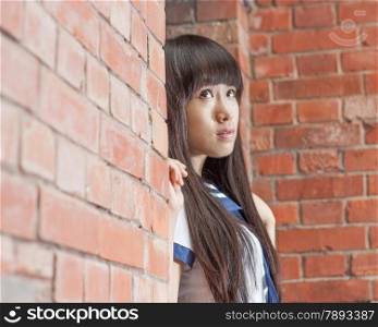 Chinese female student outside school building