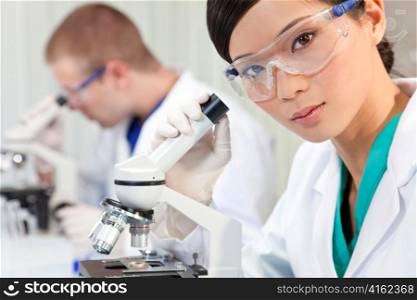 Chinese Female Woman Scientist & Microscope In Laboratory