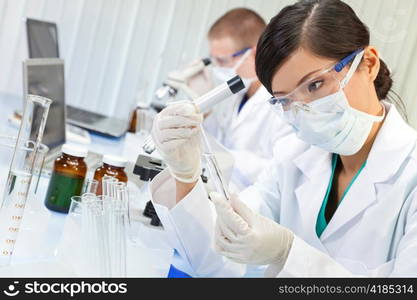 Chinese Female Woman Scientist With Test Tube In Laboratory