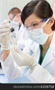 Chinese Female Woman Scientist With Test Tube In Laboratory