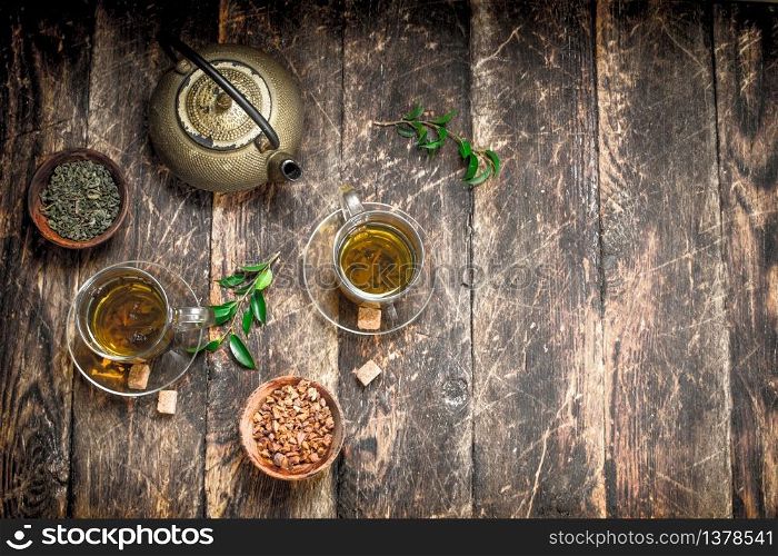 Chinese flavored tea. On a wooden background.. Chinese flavored tea.