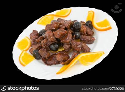 Chinese food. Caramelized meat with prunes, decorated with orange slices, clipping path.