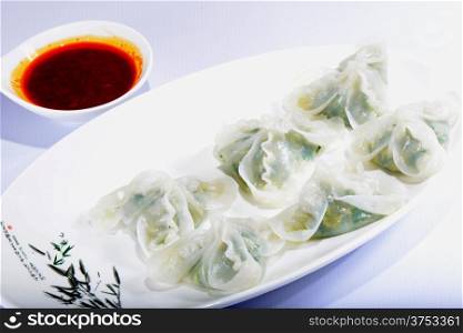 Chinese Food: Colorful steamed dumplings with sauce