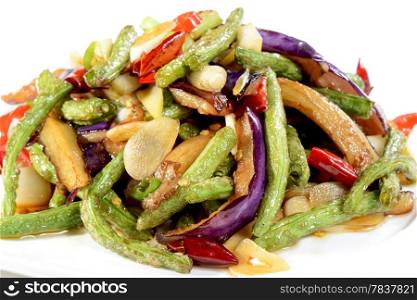 Chinese Food: Fried eggplant slices with beans in a white plate