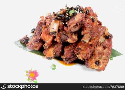 Chinese Food: Fried pork steak with black beans on a white background