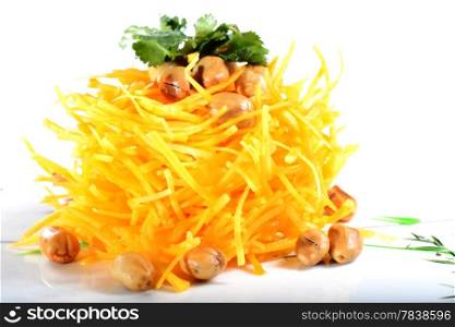 Chinese Food: Salad made of pumpkin slices and peanut kernels on a white background