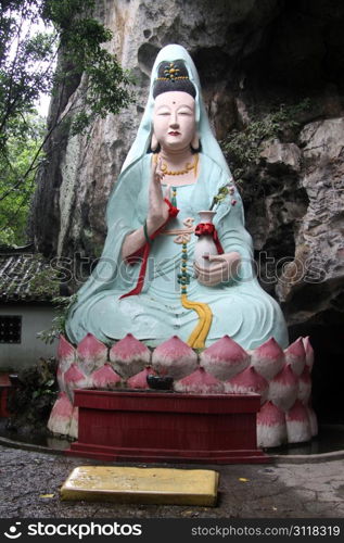 Chinese goddess Guan Yin near rock in Yanshuo, China