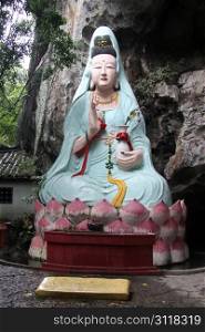 Chinese goddess Guan Yin near rock in Yanshuo, China