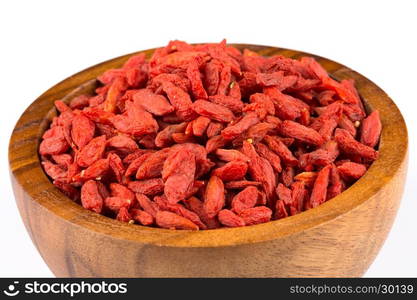 Chinese goji berries in wooden bowl close up on white background