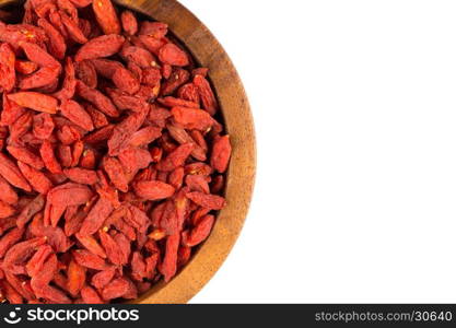 Chinese goji berries in wooden bowl close up on white background