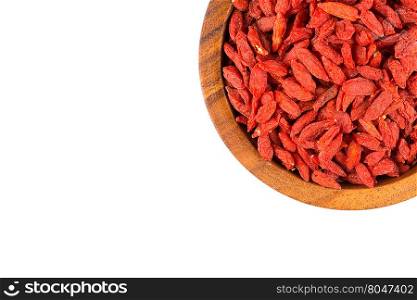 Chinese goji berries in wooden bowl close up on white background