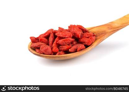 Chinese goji berries in wooden spoon close up on white background