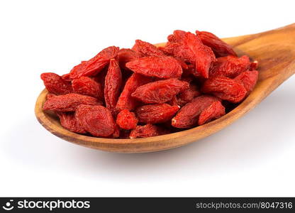 Chinese goji berries in wooden spoon close up on white background