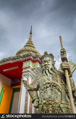 Chinese Guard statue in Wat Pho Buddhist temple, Bangkok, Thailand. Chinese Guard statue in Wat Pho, Bangkok, Thailand