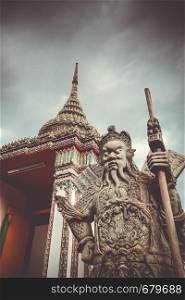 Chinese Guard statue in Wat Pho Buddhist temple, Bangkok, Thailand. Chinese Guard statue in Wat Pho, Bangkok, Thailand