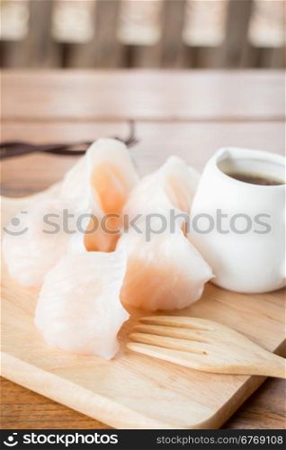 Chinese har gao dim sum dumplings on wooden plate, stock photo