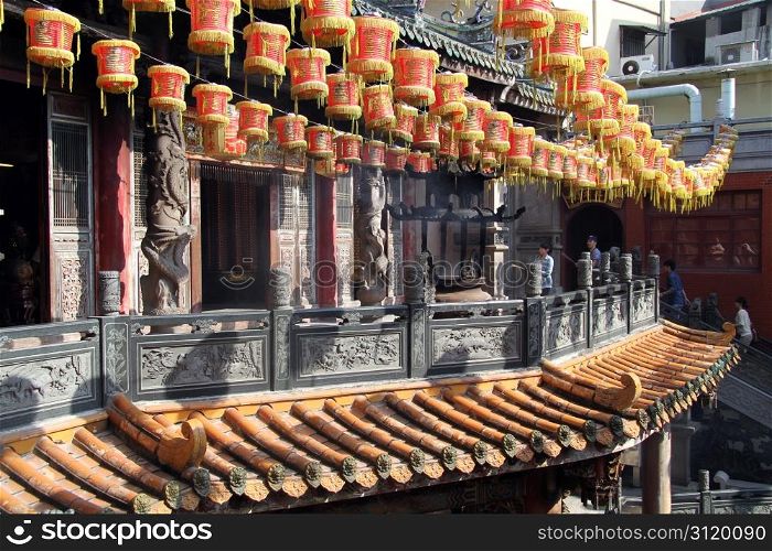 Chinese lamps and peiople in godness Matsu temple in Lukang, Taiwan