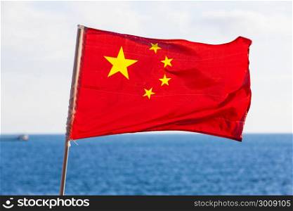 Chinese National Flag Against Blue sea