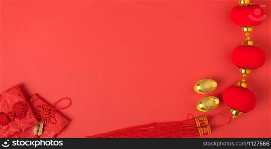 "Chinese new year concept, flat lay top view, Happy Chinese new year with Red envelope and gold ingot (Character "FU" means fortune, blessing, wealth) on red background with copy space for your text"
