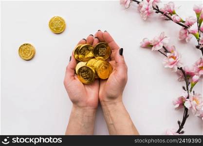 chinese new year concept with hands holding coins