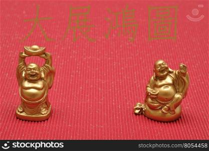 Chinese New Year design. Laughing cheerful Buddha isolated against a red background. Translation : May you realize your ambitions