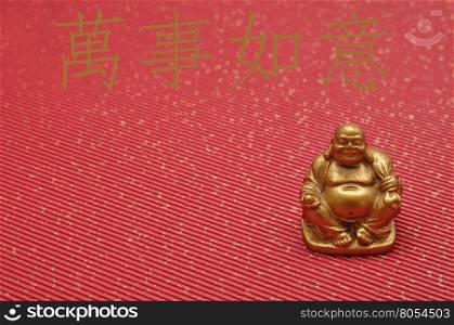 Chinese New Year design. Laughing cheerful Buddha isolated against a red background. Translation : May all your wishes be fulfilled