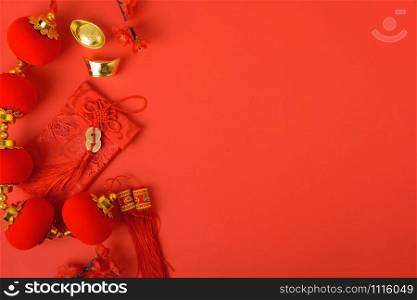 Chinese new year festival concept, flat lay top view, Happy Chinese new year with Red envelope and gold ingot on red background with copy space for your text