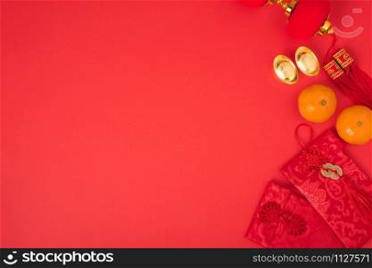 "Chinese new year festival concept, flat lay top view, Happy Chinese new year with Red envelope and gold ingot (Character "FU" means fortune, blessing) on red background with copy space for text"