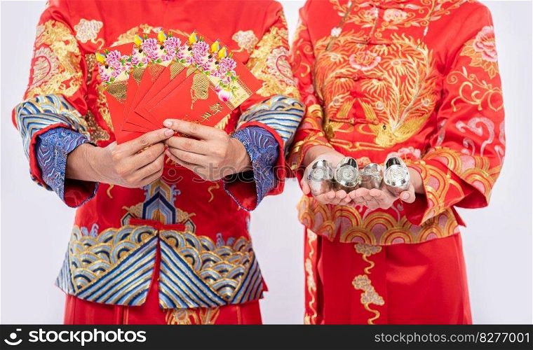 Chinese new year, gift money and cash will be get - give to men and woman wear Cheongsam for traditional