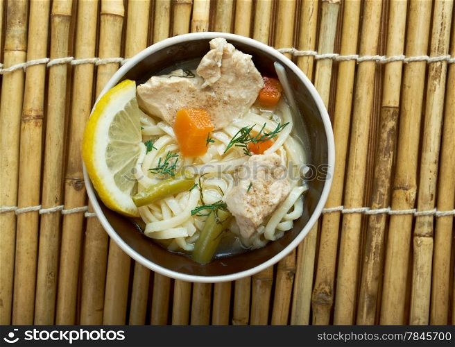 chinese noodle with chicken and vegetables on wood table